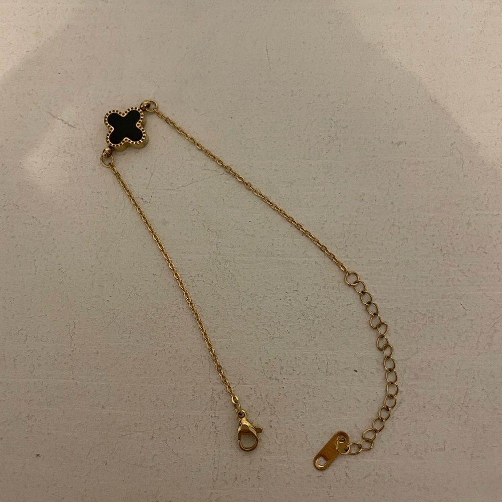 Pretty clover bracelet in gold and black/white.  Almost new! Trendy and delicate